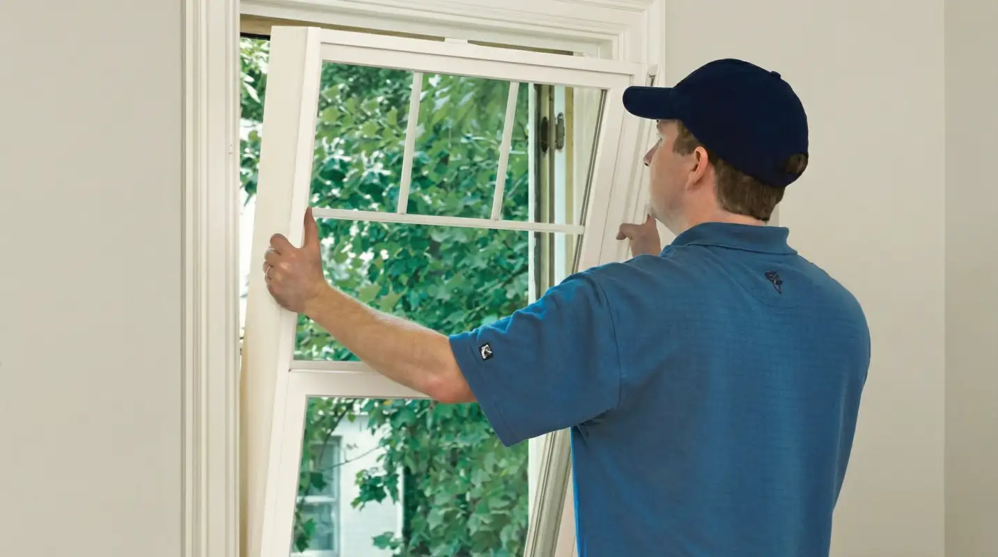 Professional contractors performing a residential window insulation and replacement service in Boulder, CO